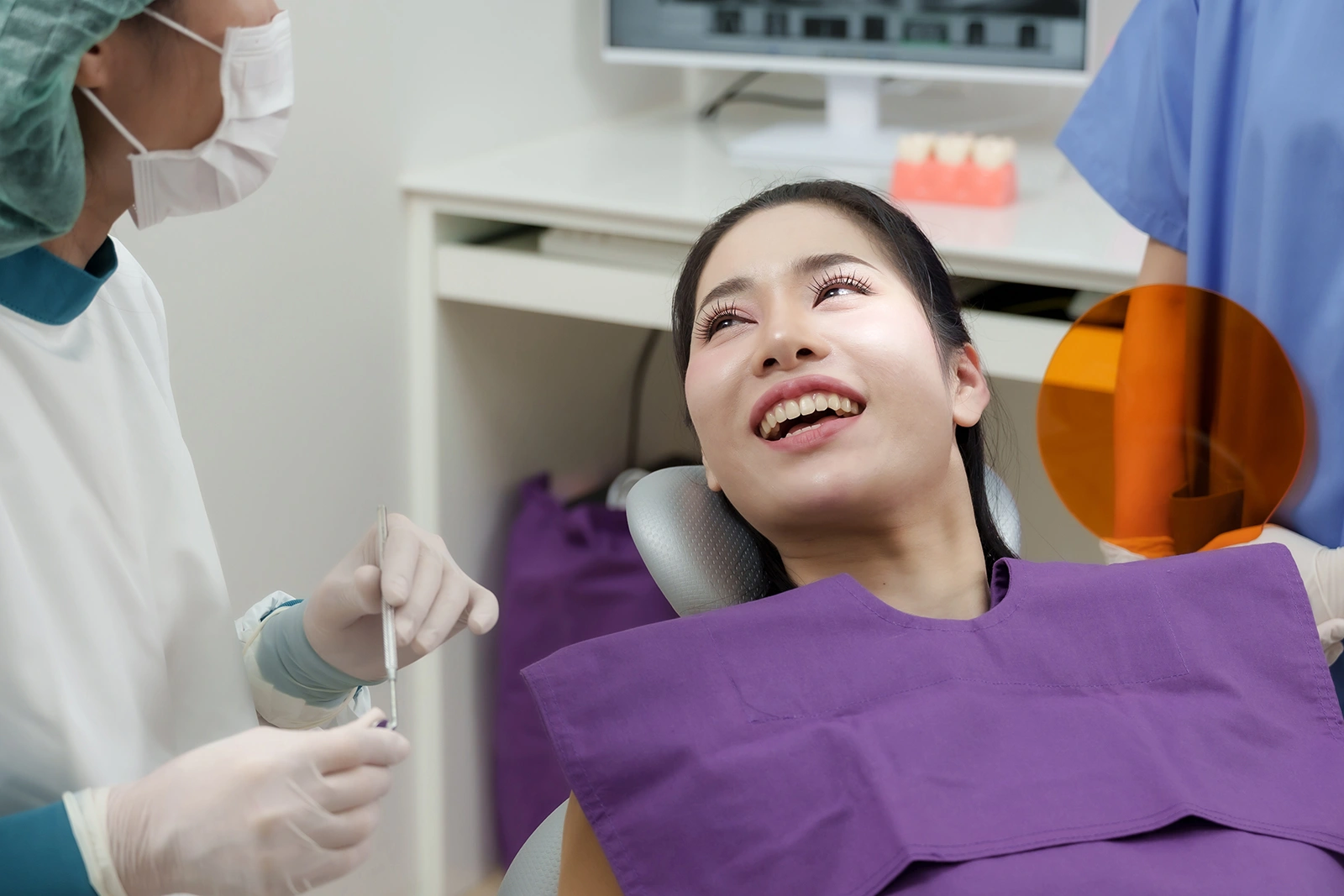 Patient smiling in dentist chair before root canal procedure