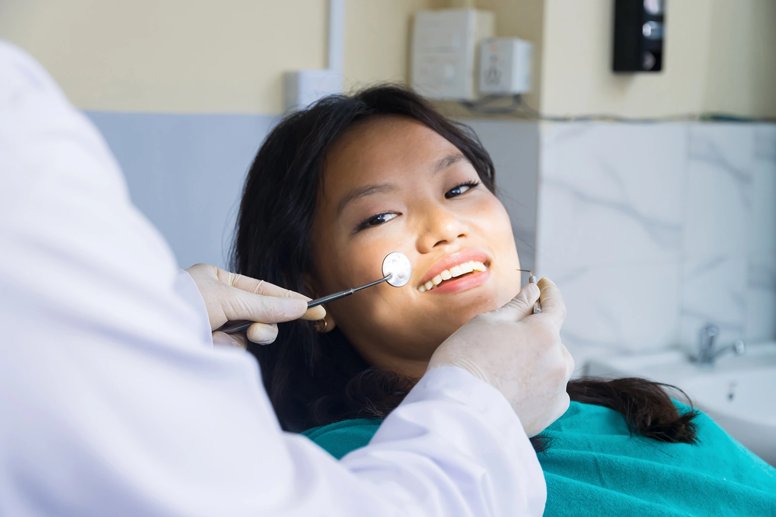 Woman receiving treatment at a dental specialist clinic in Singapore